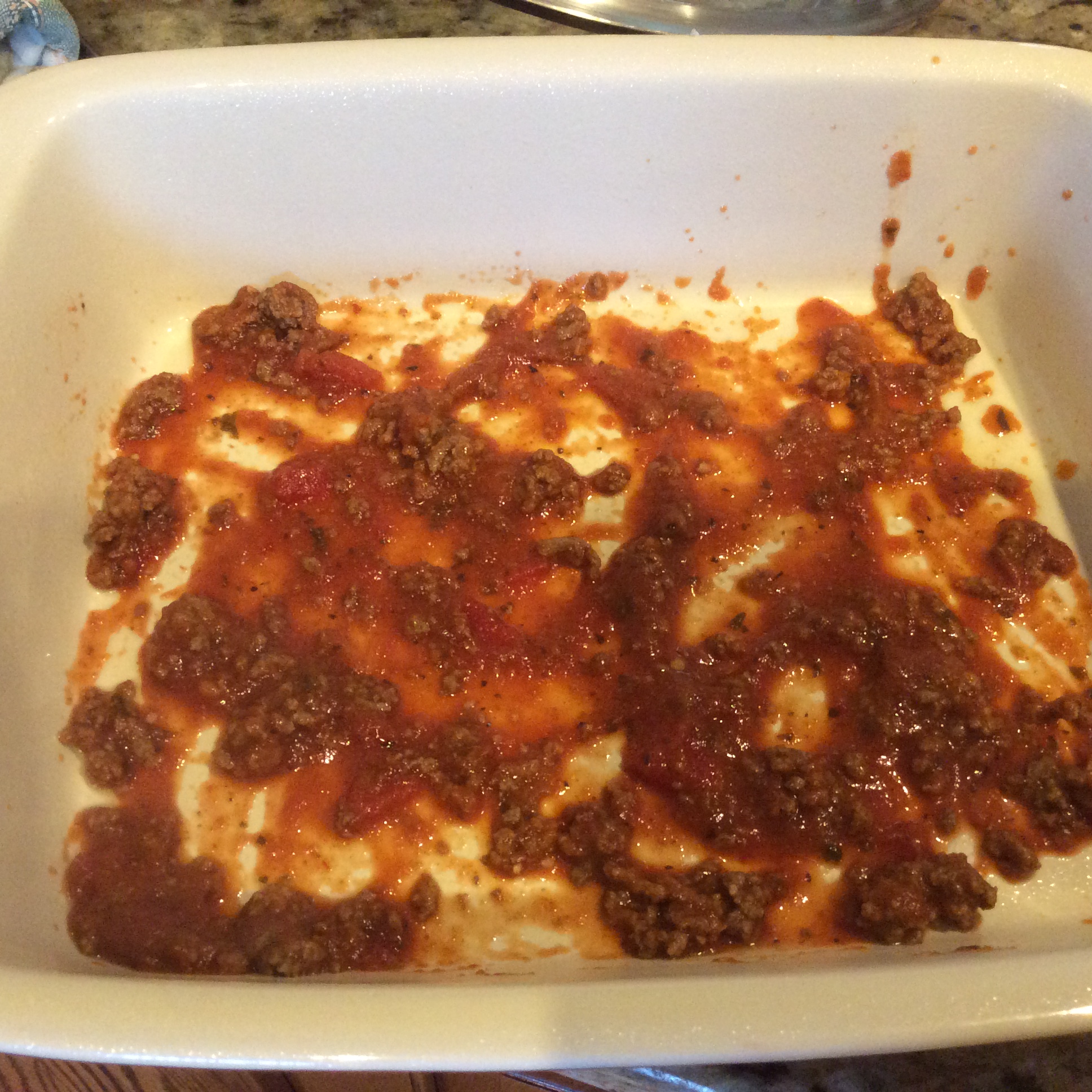Meat sauce at the bottom of baking dish